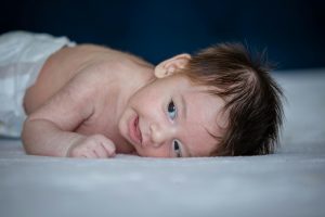 baby lying on his stomach